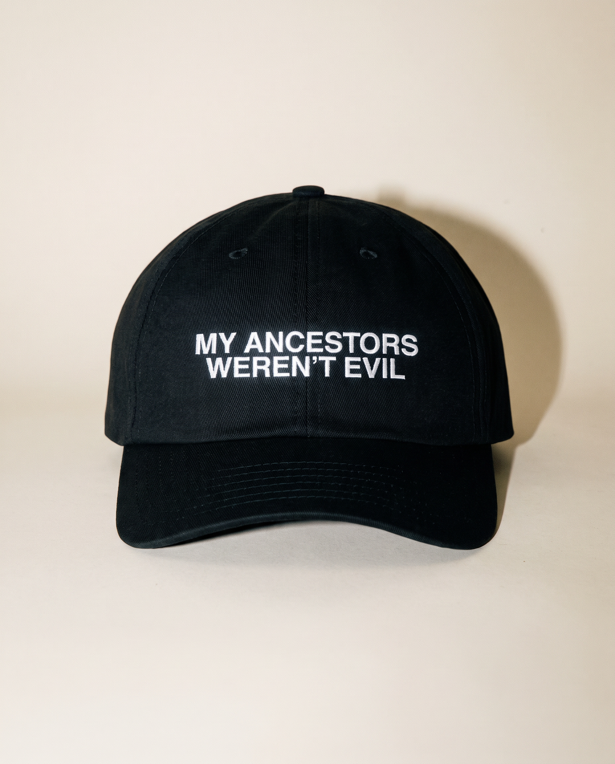 Black My Ancestors Weren't Evil hat with white embroidery, front view