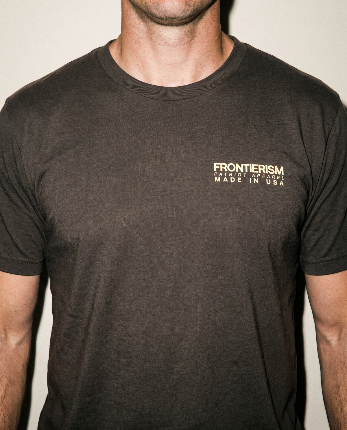 Front of the chocolate brown Every Frontier t-shirt with a small Frontierism Patriot Apparel chest print