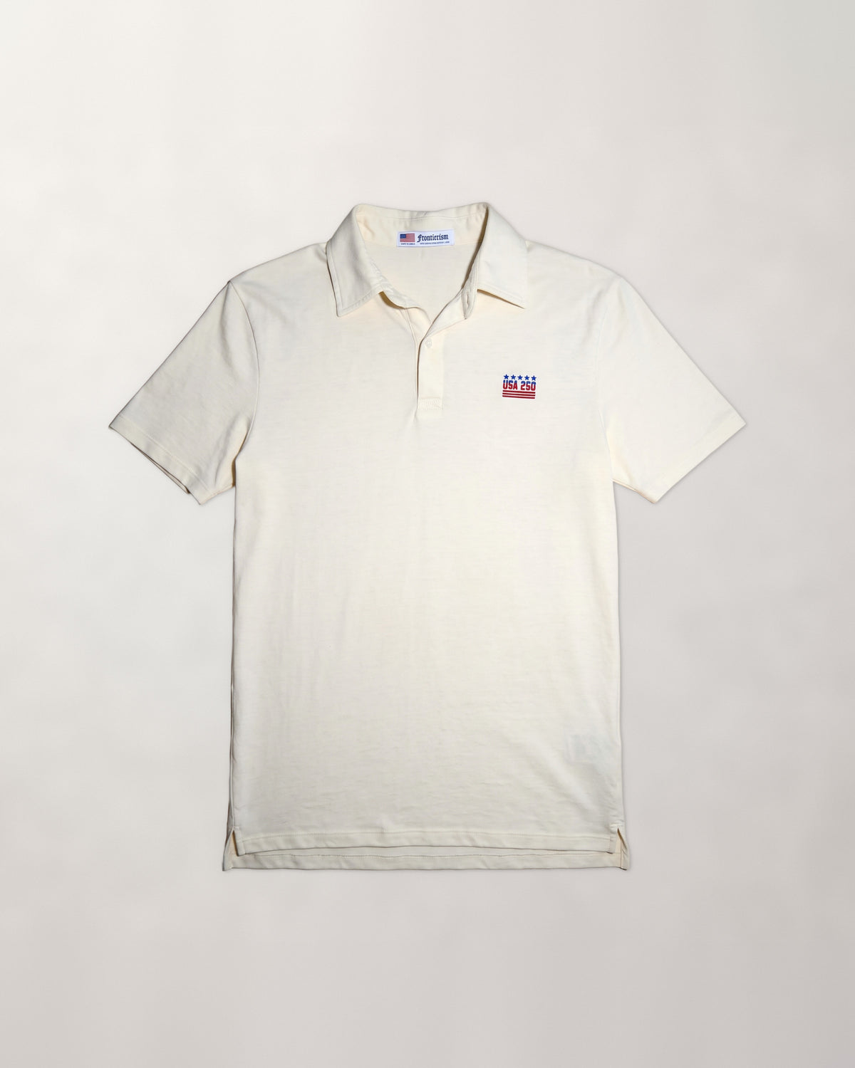 The 250 Polo in Cloud Cream, flat lay with USA 250 embroidery on the chest